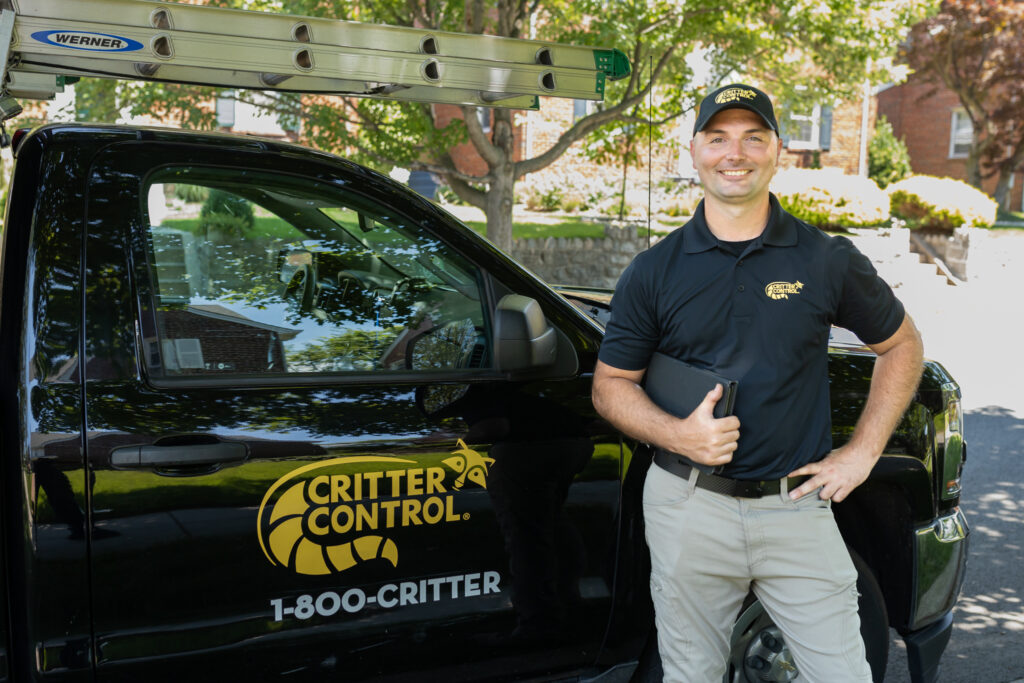 Smiling critter control truck