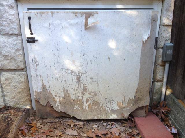 Animal damage to a crawlspace entrance